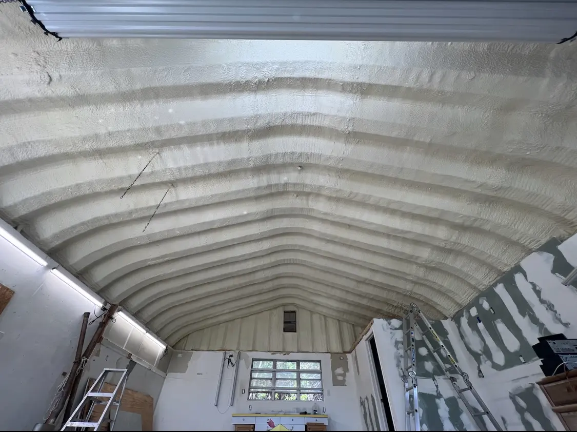 Spray polyurethane foam applied to the underside of a metal roof deck in Lebanon